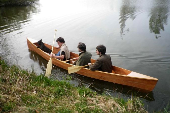 This wooden canadian canoe can carry up to three people