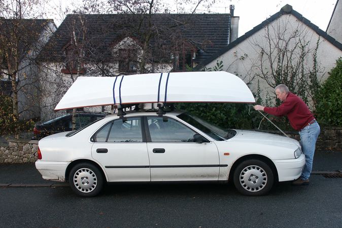 Wooden dory fits on a car roof rack